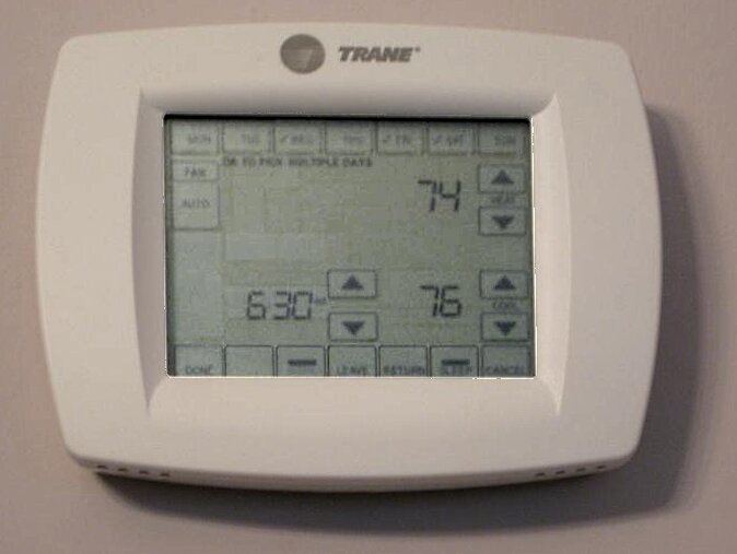 Residential Trane touchscreen thermostat on a wall